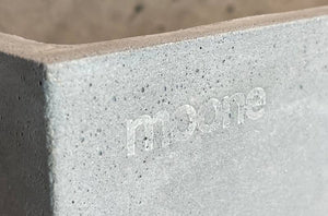 Moone logo on concrete planter box